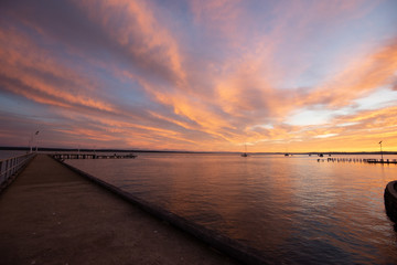 Fototapeta na wymiar Corinella pier at sunrise viewed along length