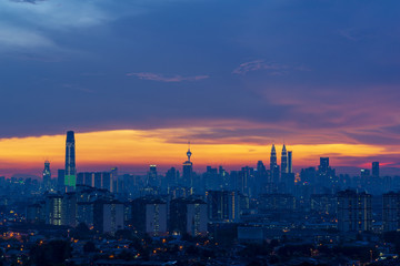 Majestic sunset over downtown Kuala Lumpur, a capital of Malaysia. Its modern skyline is dominated by the 451m-tall Petronas Twin Towers.