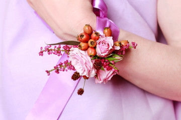 Wrist corsage for autumn wedding.  Bouquet of pink roses and heather.