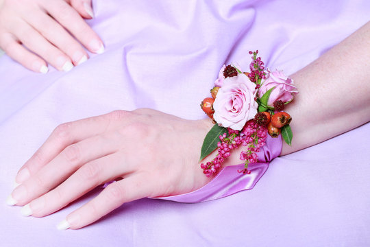 Wrist corsage for autumn wedding.  Bouquet of pink roses and heather.