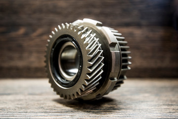 CVT transmission pinion on wooden background