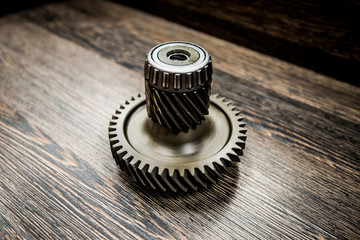 CVT transmission pinion on wooden background