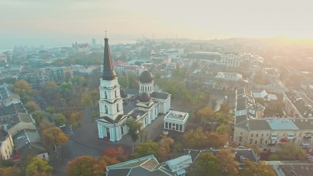 Orbiting aerial shot of Transfiguration Cathedral and Odessa city center