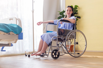 Fototapeta na wymiar Disabled woman sitting in wheelchair in Patient room.