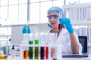 Young asian women scientist research and test in laboratory.