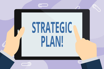 Handwriting text writing Strategic Plan. Conceptual photo analysisagement activity that is used to set and focus priorities Businessman Hand Holding, Pointing and Touching Colorful Tablet Blank Screen