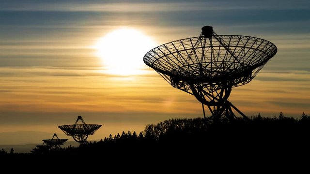 Westerbork Synthesis Radio Telescope (WSRT) at Sunset, aperture synthesis interferometer of a linear array of 14 antennas in Netherlands