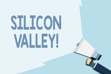 Writing note showing Silicon Valley. Business concept for home to analysisy startup and global technology companies Hand Holding Megaphone with Beam Extending the Volume Range