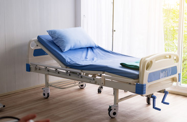 Empty sick bed at hospital room for supporting patients