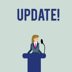 Text sign showing UPDATE. Business photo text make something more modern or up to date like software program Businesswoman Standing Behind Podium Rostrum Speaking on Wireless Microphone