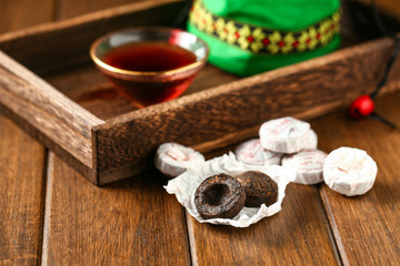 Chinese traditional pu erh tea in plate and tea cup