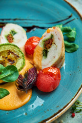 chicken roll stuffed with spices with grilled vegetables 