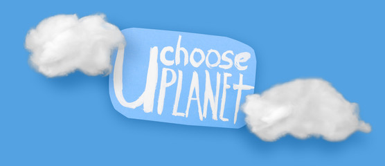 Ecology text sticker handmade and clouds above plastic forks. Ecology Concept for Earth Hour, Earth Day, Ocean Day and other ECO dates.