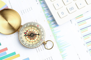 compass, calculator on financial graph, Business investment concept