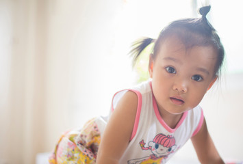 The face, the innocent and joyful face of the Asian girl.