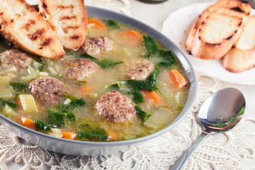 Italian wedding soup with meatballs and vegetables