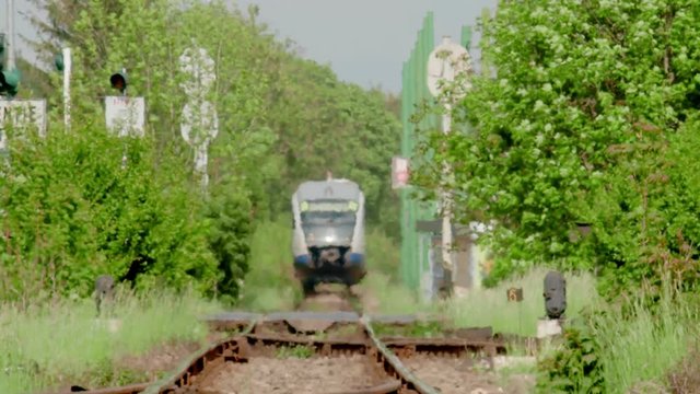 Heath waves effect on distant train approaching in summer