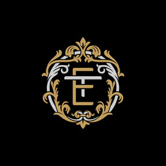 Initial letter T and E, TE, ET, decorative ornament emblem badge, overlapping monogram logo, elegant luxury silver gold color on black background