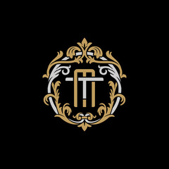 Initial letter T and M, TM, MT, decorative ornament emblem badge, overlapping monogram logo, elegant luxury silver gold color on black background