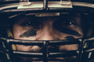 Portrait close-up, American football player, bearded in helmet. Concept American football,...