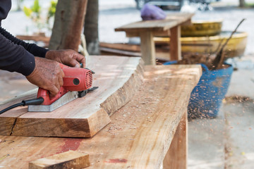 carpenter working on site by tools
