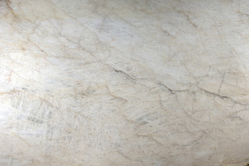 Natural stone polished white quartzite with cracks and streaks