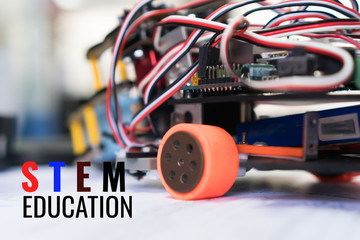 Code of learning construction car robotics on electronic board with equipment in laboratory of school.Concept of STEM education related of mathematics engineering science technology study for children