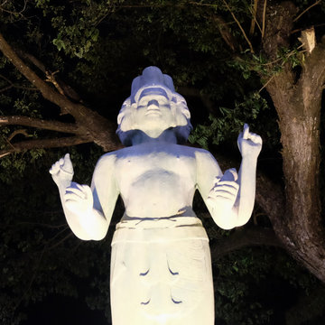 Sculpture Of A Hindu Deity With Four Arms And Several Faces