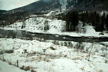 Fototapeta na wymiar Southern Norway, view of river in winter between Oslo and Bergen