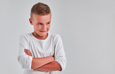 Cute boy on a gray background