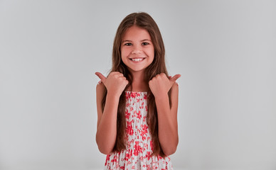 Cute girl on a gray background