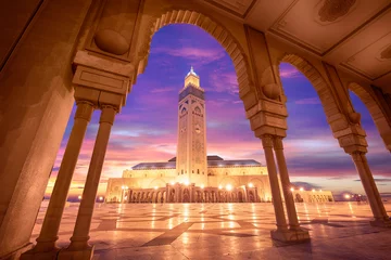 Wall murals Morocco The Hassan II Mosque at sunset in Casablanca, Morocco. Hassan II Mosque is the largest mosque in Morocco and one of the most beautiful. the 13th largest in the world.