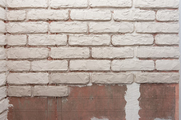 Unfinished imitation of brickwork on the wall