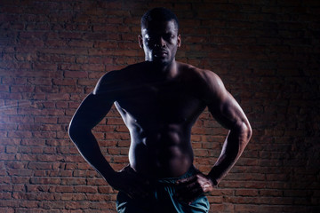 Fototapeta premium african american man with dumbbell weight training equipment gym