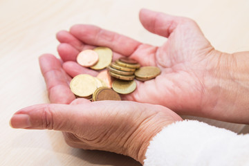 hands holding coins, saving concept