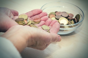 hands holding coins, saving concept