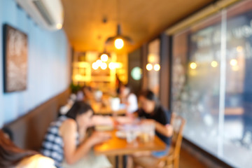 Blurred group of people sitting in cafe restaurant