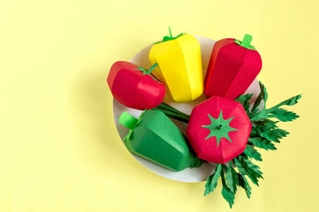 Paper tomatoes, peppers and parsley on paper plate