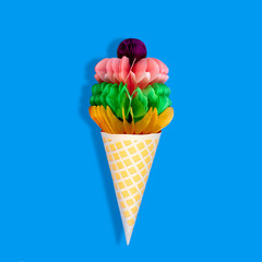 Big ice cream in waffle cone made of paper