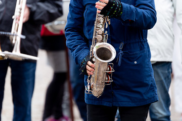 Female Playing Saxohpone Outdoors