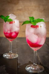 Fresh Ice Mulberry Soda drink on the wood table there is same object placed back side.