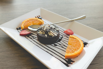 chocolate lava cake with fresh fruit and coffee