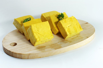 yellow tofu on cutting board