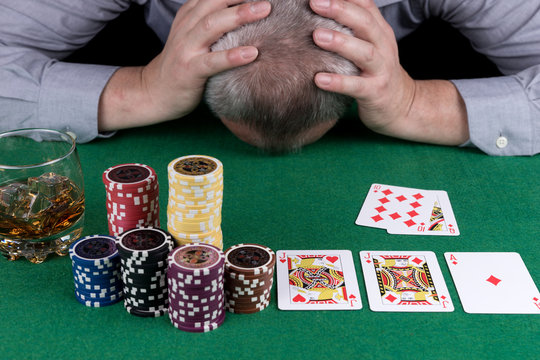 It is not my day. Depressed senior man lays his head on the table