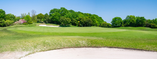 Panorama View of Golf Course with beautiful green. Golf is a sport to play on the turf.	