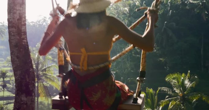 Beautiful girl spending day at the rice terrace in Bali