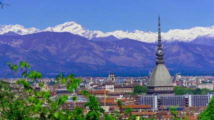 Turin, Torino, aerial timelapse skyline panorama with Mole Antonelliana, Monte dei Cappuccini and the Alps in the background. Italy, Piemonte, Turin.