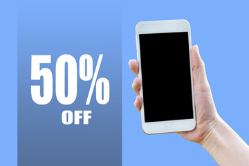 Hand holding Mobile smart phone on 50% off on light blue background