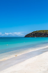 An idyllic sandy beach on the Caribbean Island of Antigua