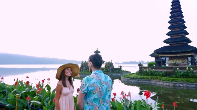 Couple spending time at the ulun datu bratan temple in Bali